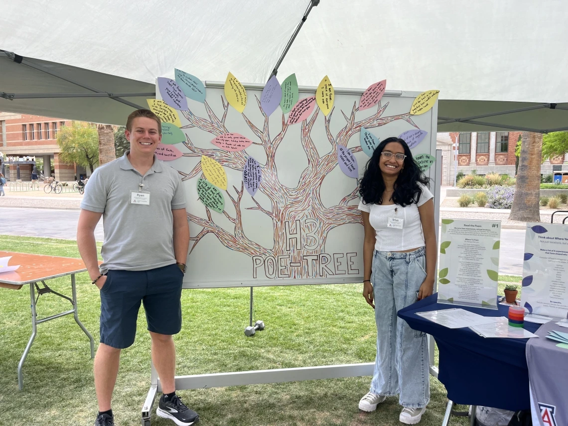Ryan and Sriya Standing with the Poe-tree