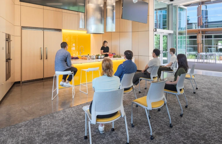 Group of seated students watching a kitchen demo