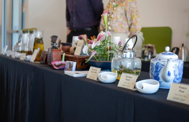 Tabletop of tea kettles from a tea demonstration