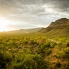Sun shining through clouds over Gates Pass near Tucson, AZ